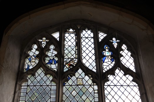 Only fragments of stained glass remain in some of the windows