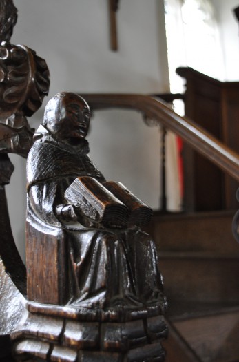 Detail of a carved pew in Belchamp St Paul church