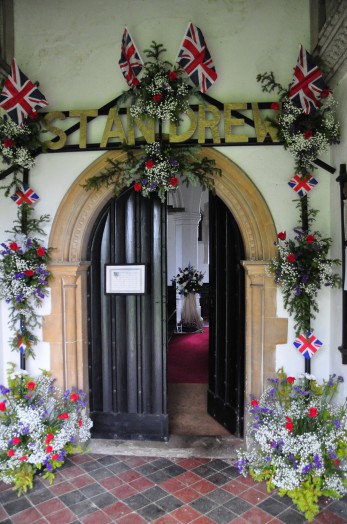 The door to St Andrews' Church Belchamp St Paul, featuring flowers for the Jubilee weekend 2012