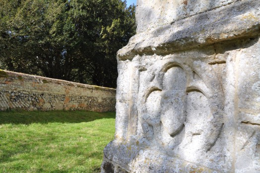 Carved stone on the 15th century church tower at Belchamp Walter