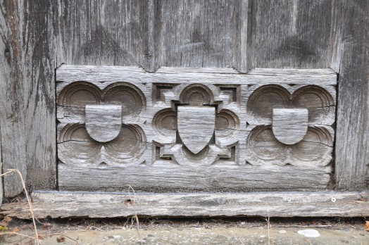 Carving detail in a side door at Borley Church