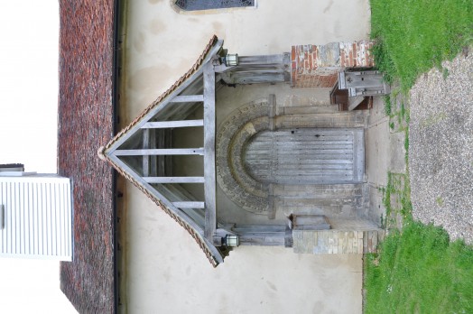 The original Norman door is surrounded by a distinctive Norman zig-zag pattern