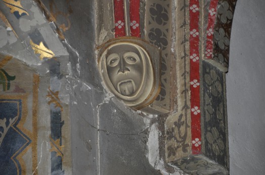 Detail of a carved stone face in the ceiling of Foxearth church.