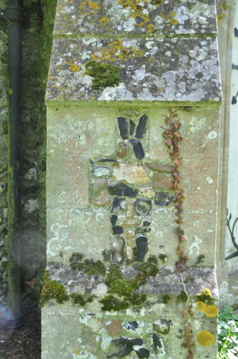 A stone mason's mark in a buttress at Wickham St Paul church