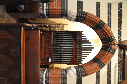 The organ and striking brickwork inside Twinstead Church