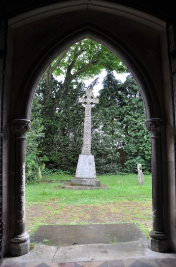 View from the inside looking out over the churchyard at Foxearth church.