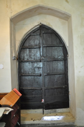 The door of Wickham St Paul church from inside